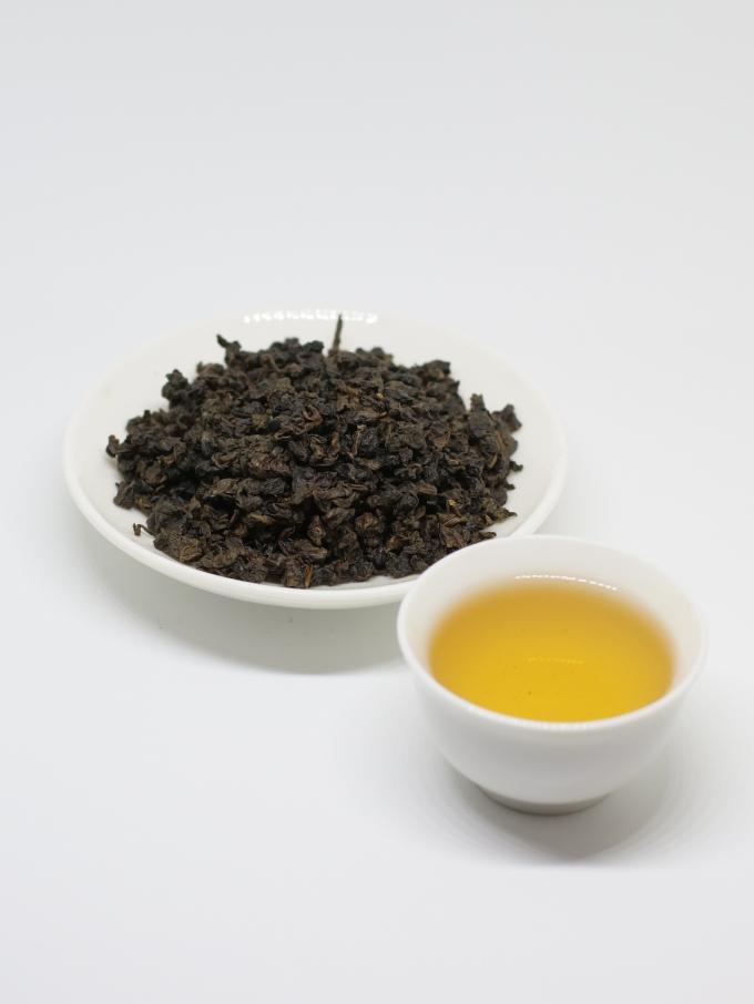 Legame organico Guan Yin del tè di Oolong della primavera con le foglie di tè verdi appiattite